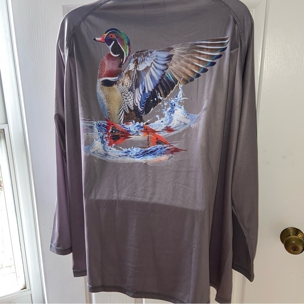 Homerun Apparel with male wood duck making a splash in the back. Wicking jersey.
